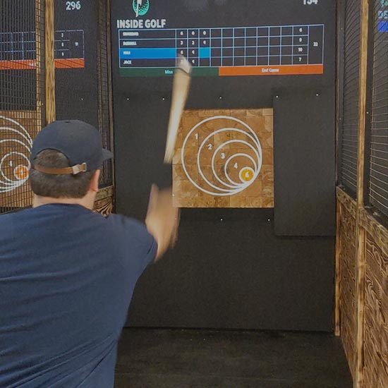 Man throwing an axe at a target