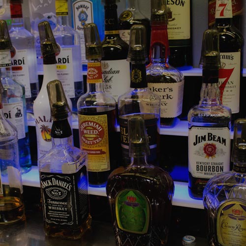 Bottles of liquor behind the bar at Inside Golf